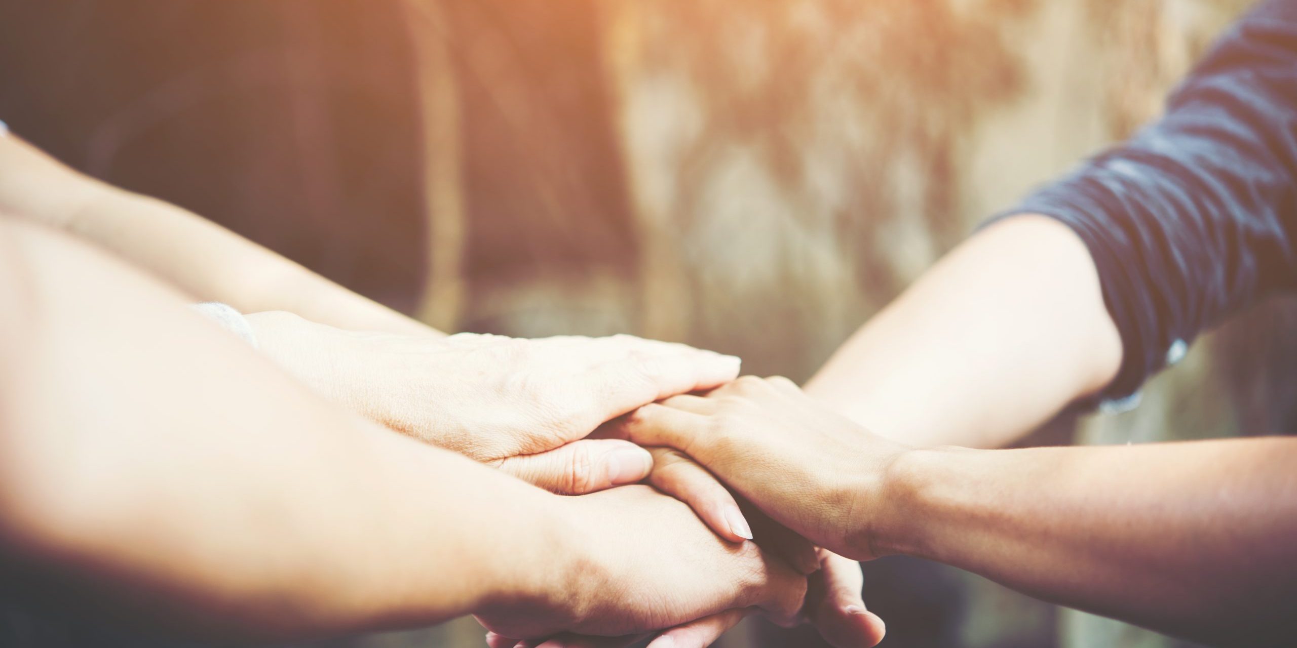 Business teamwork standing hands together.